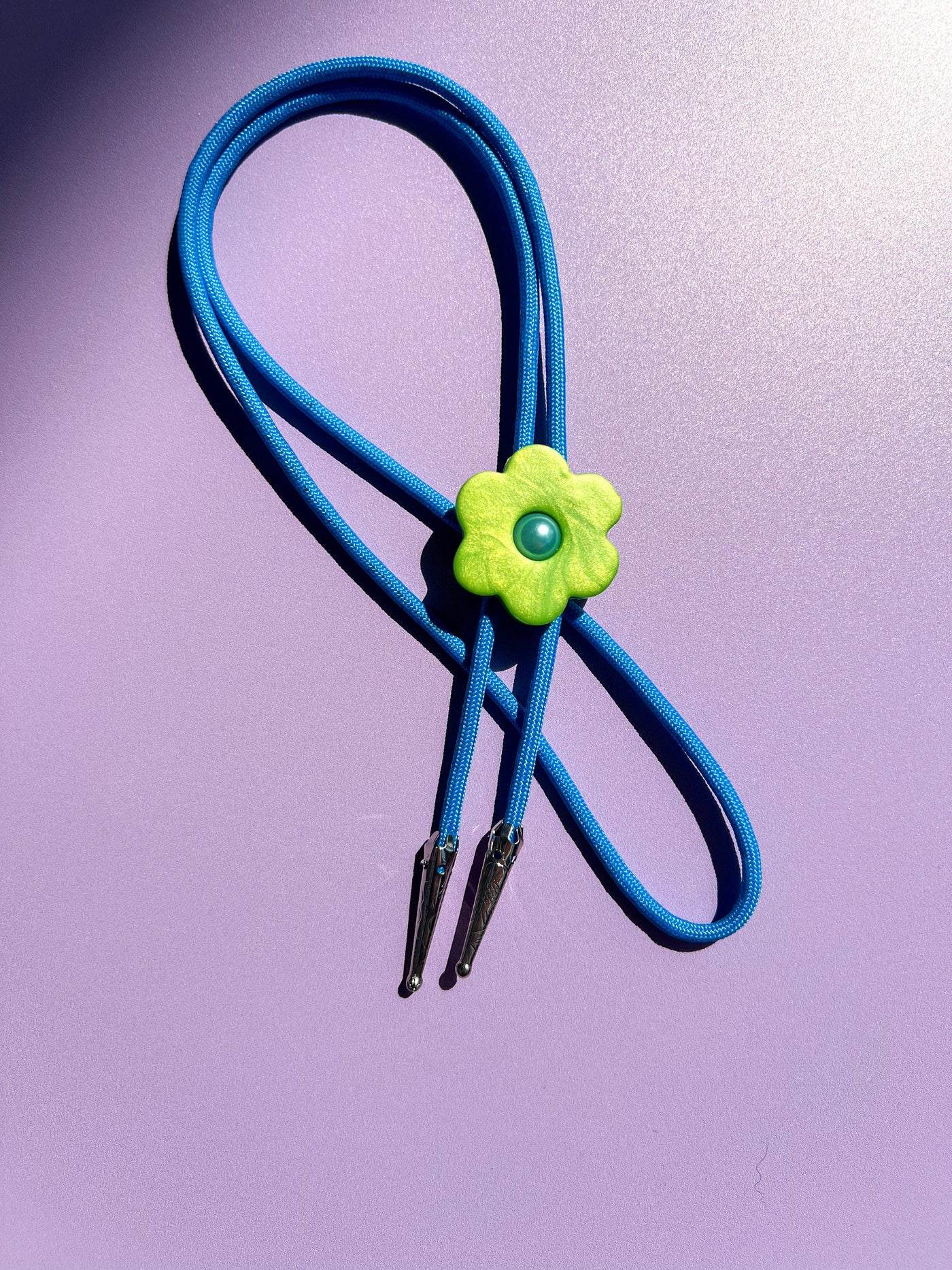 Green Flower Blue Cord Bolo Tie