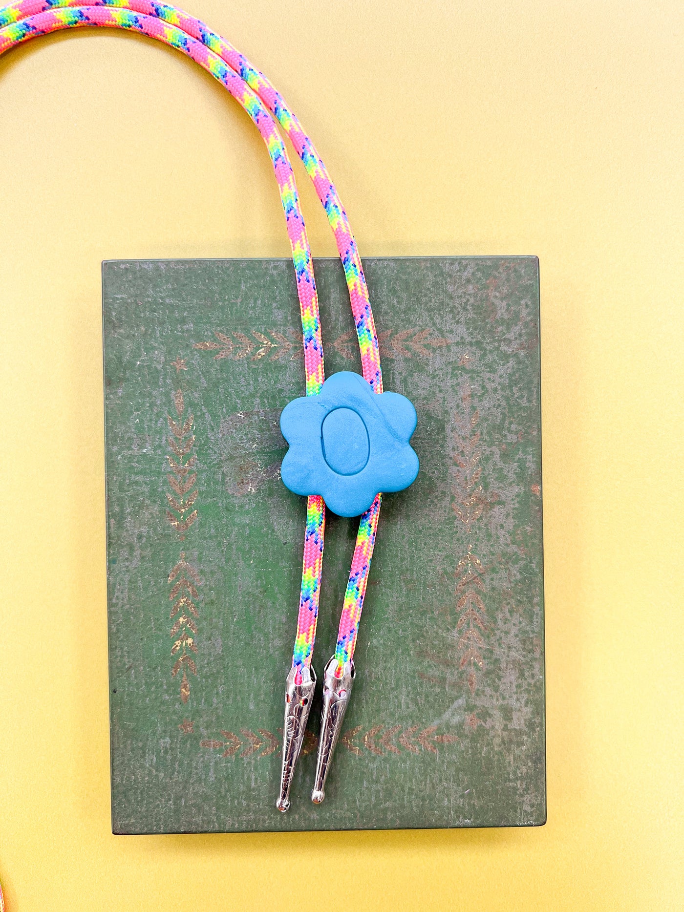Rainbow Cord Blue Flower Bolo Tie