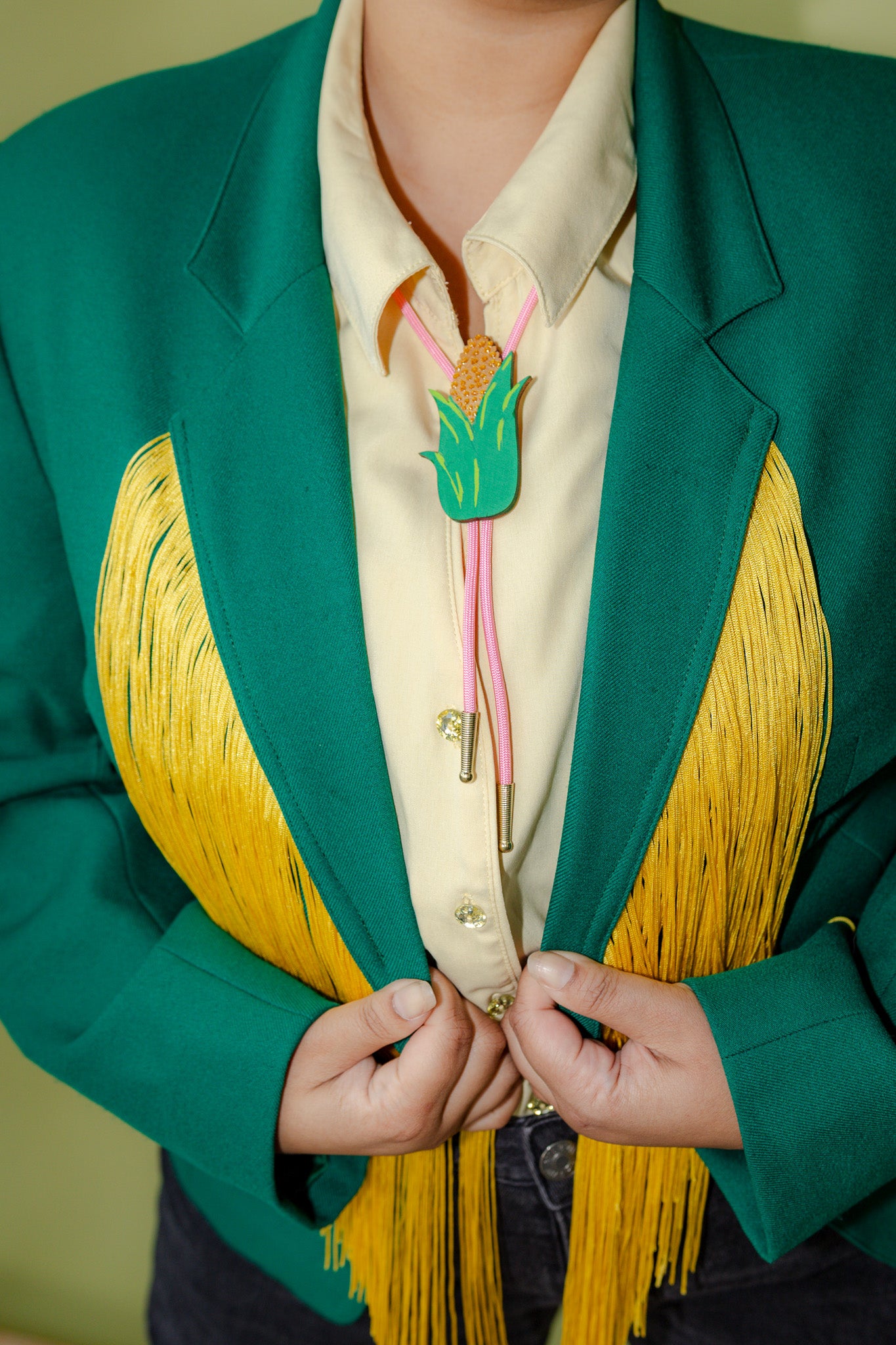 Sitting Woman Long Fringe Chain Stitch Green Blazer